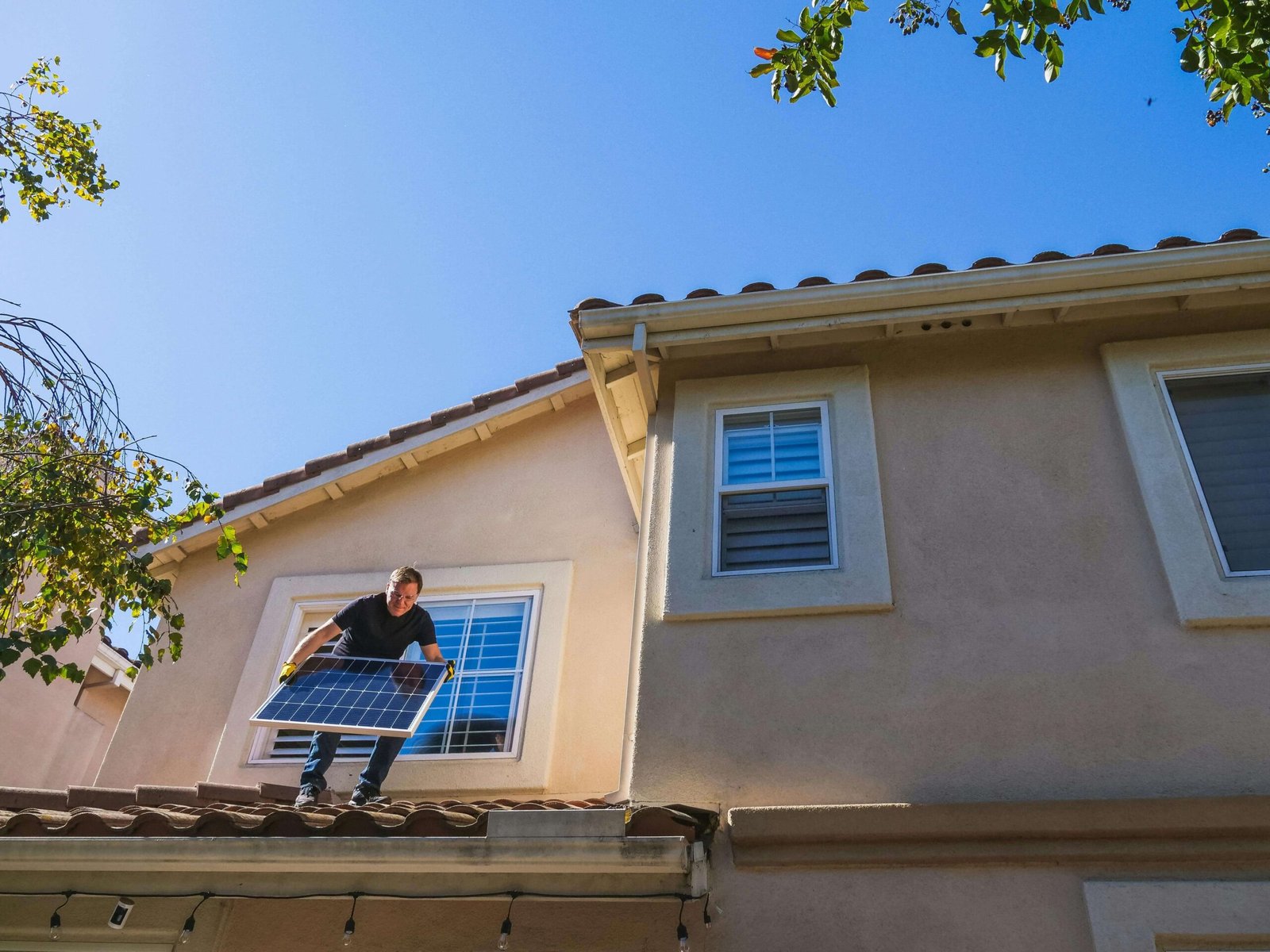 Person Installing Solar Panel scaled