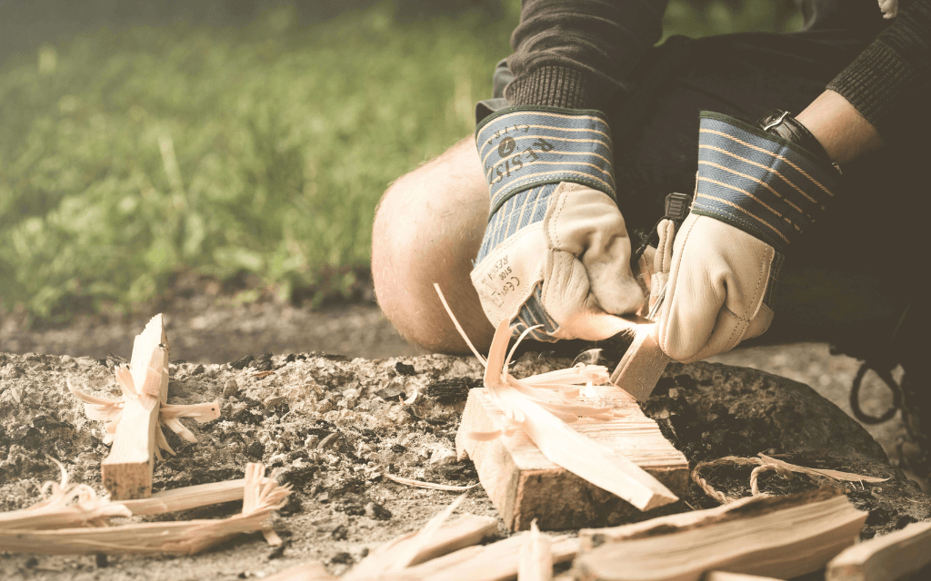 Person practicing fire starting with basic tools