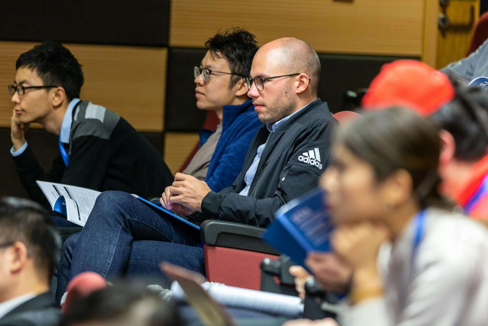 individuals of different backgrounds engaged in a collaborative learning environment scaled